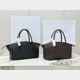 The Row Ewa curved handbag